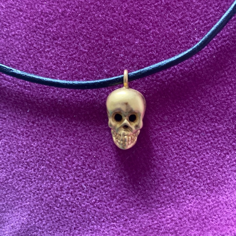 Scull charm necklace on leather chain. Costume